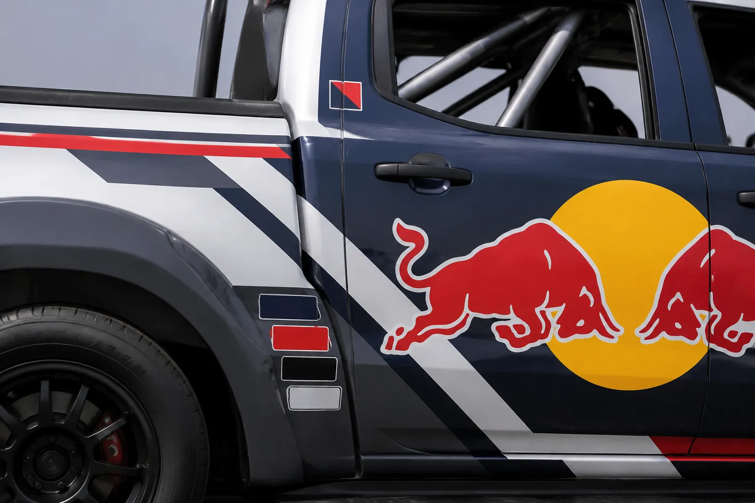 Pickup cab and bed graphic zones showing logo hierarchy and body transition decisions